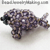 beaded purple seal