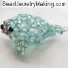 beaded turquoise seal